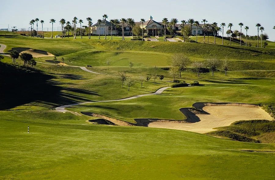View of golf clubhouse on hill